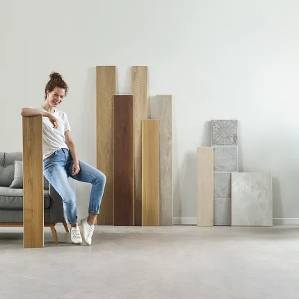 Luxury Vinyl Flooring Samples in Wood and Stone Look for Modern Interiors Modern living room with a variety of luxury vinyl flooring samples in wood and stone look, including shades of oak, walnut, and grey
