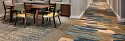 Senior Living Facility with Vibrant Commercial Carpet Tile Design Modern senior living facility with stylish furniture and vibrant commercial carpet tile in shades of blue, beige, and brown