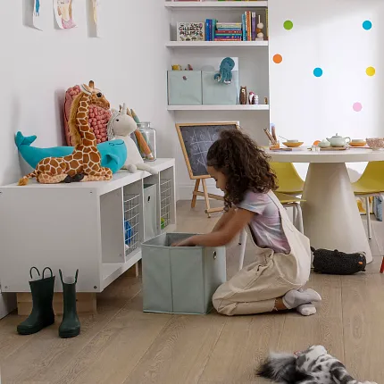 Playroom with Wood Look Luxury Vinyl Plank Flooring Child playing in a colorful playroom with wood look luxury vinyl plank flooring