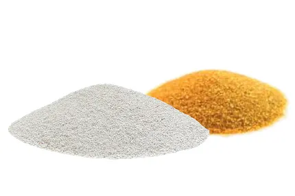 White and yellow granule samples for flooring applications Piles of white and yellow granules on a white background