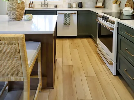 Luxury Vinyl Plank Flooring in Modern Kitchen with Green Cabinets Modern kitchen with green cabinets and luxury vinyl plank flooring