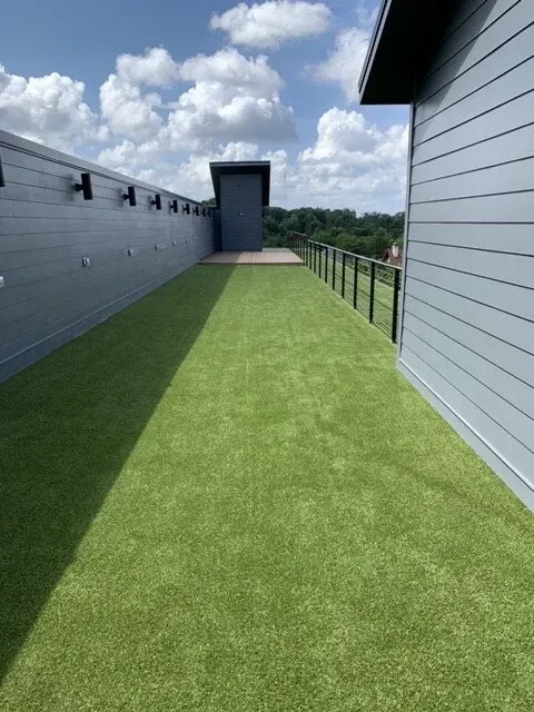 Green artificial grass on rooftop terrace