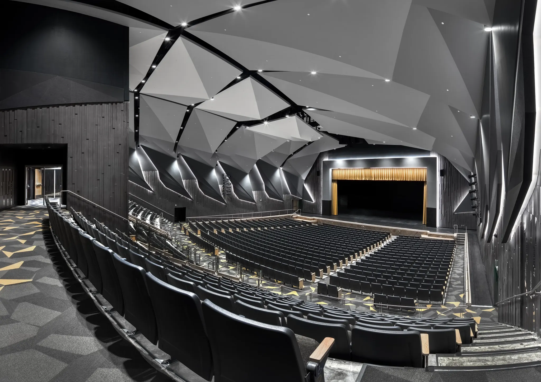 High School lecture Hall with black, green, yellow carpet tile