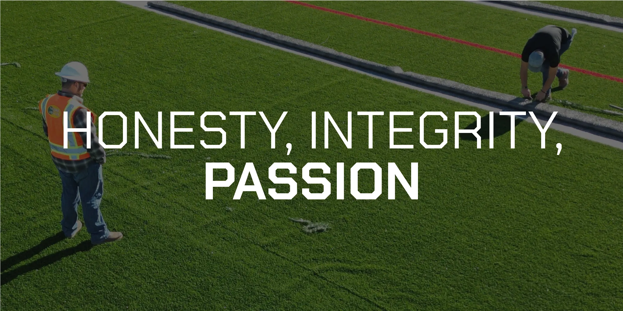 Workers installing artificial turf with text "Honesty