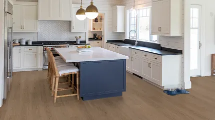 Light Oak Hardwood Flooring in Contemporary Kitchen Design Modern kitchen with light oak hardwood flooring, white cabinetry, and a navy blue island