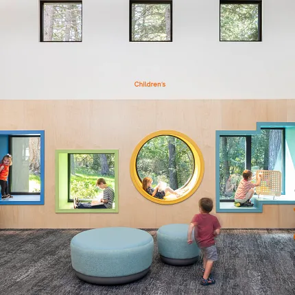 Education Facility with Commercial Carpet Tile Flooring in Children's Area Children's education facility with commercial carpet tile flooring in a playful setting, featuring 9x36 inch carpet tiles