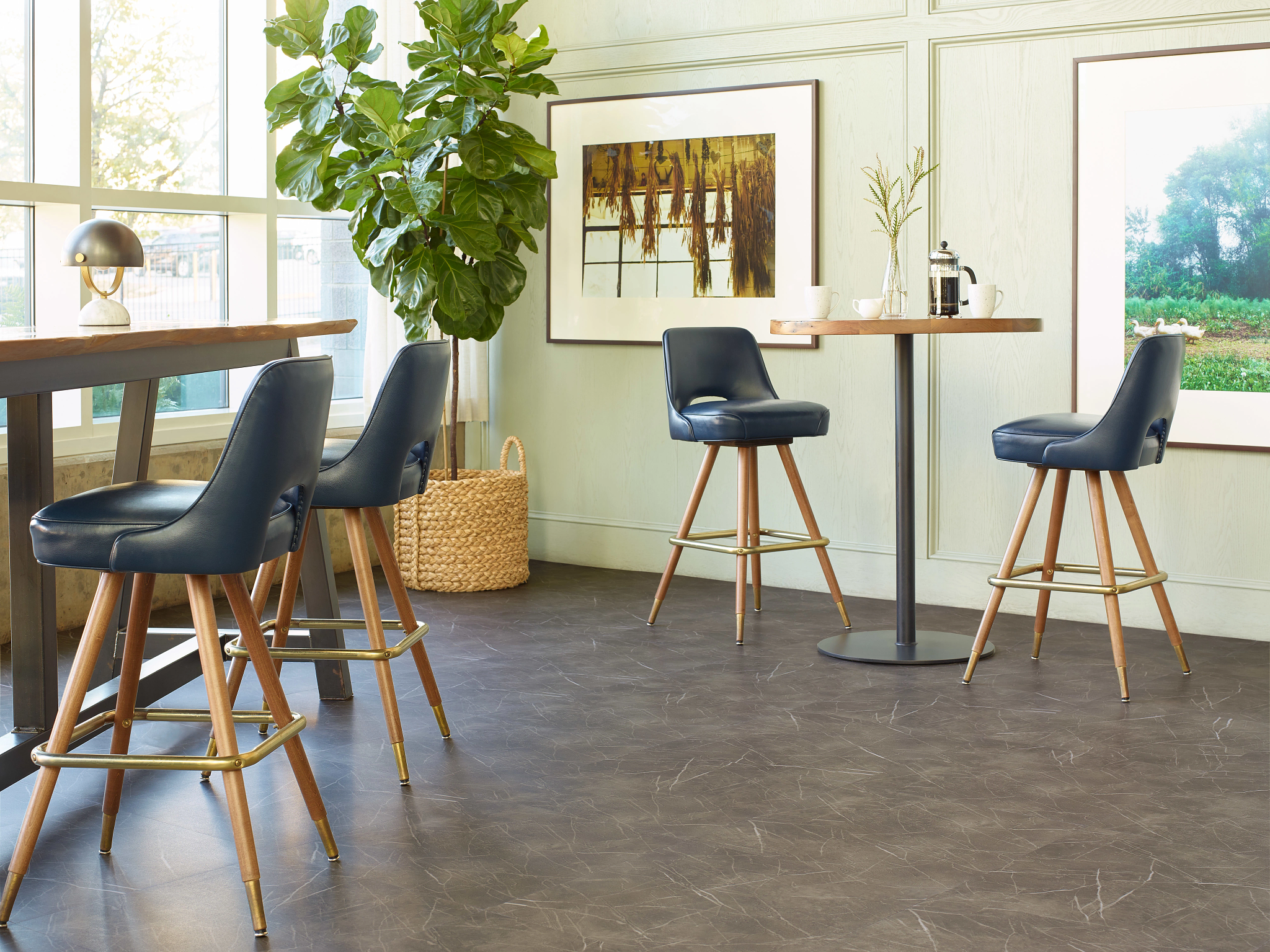 
  "Modern room with high performance luxury vinyl tile flooring in a 23.62x23.62 inch dimension, featuring dark gray tones and mid-century style chairs."
)