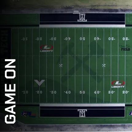 Artificial Turf Football Field with Liberty and M Logos Aerial view of a football field with artificial turf featuring Liberty and M logos