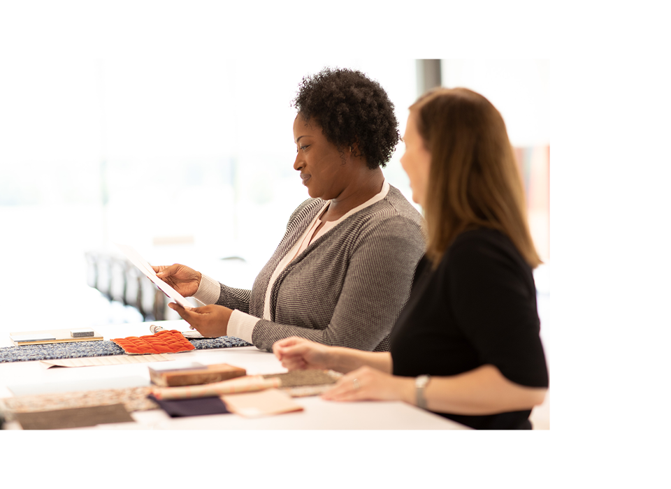 2 Designers looking at product swatches