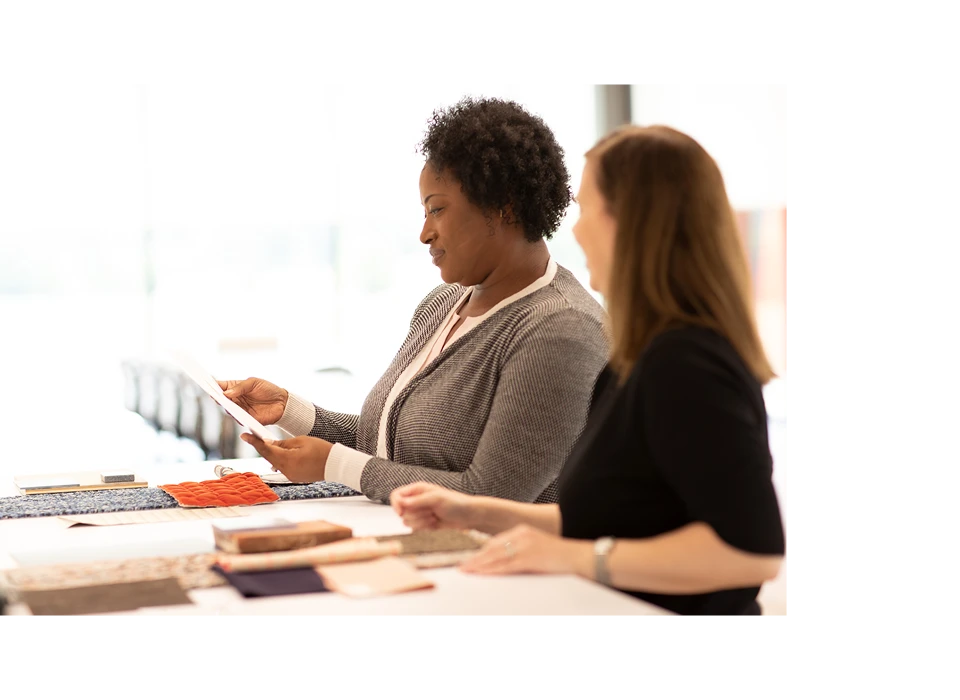 2 Designers looking at product swatches