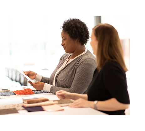 2 Designers looking at product swatches