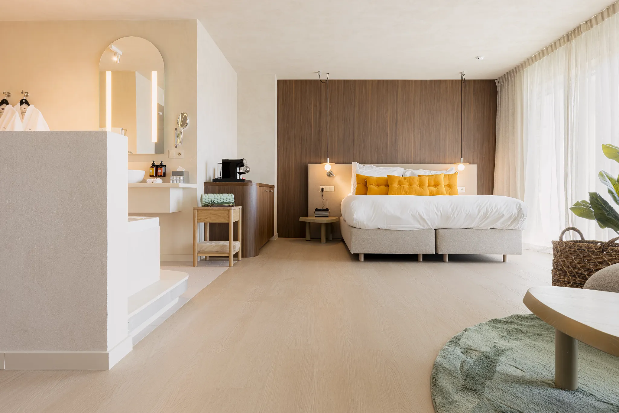 Modern hotel room with bathroom and premium waterproof Coretec floors