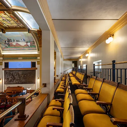 Elegant broadloom carpet in government auditorium Government facility with yellow seating and broadloom carpet