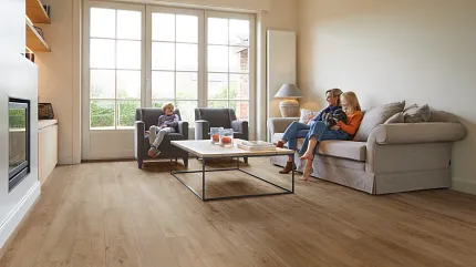 Wood Look Luxury Vinyl Plank Flooring in Contemporary Living Room Modern living room with wood look luxury vinyl plank flooring and natural light