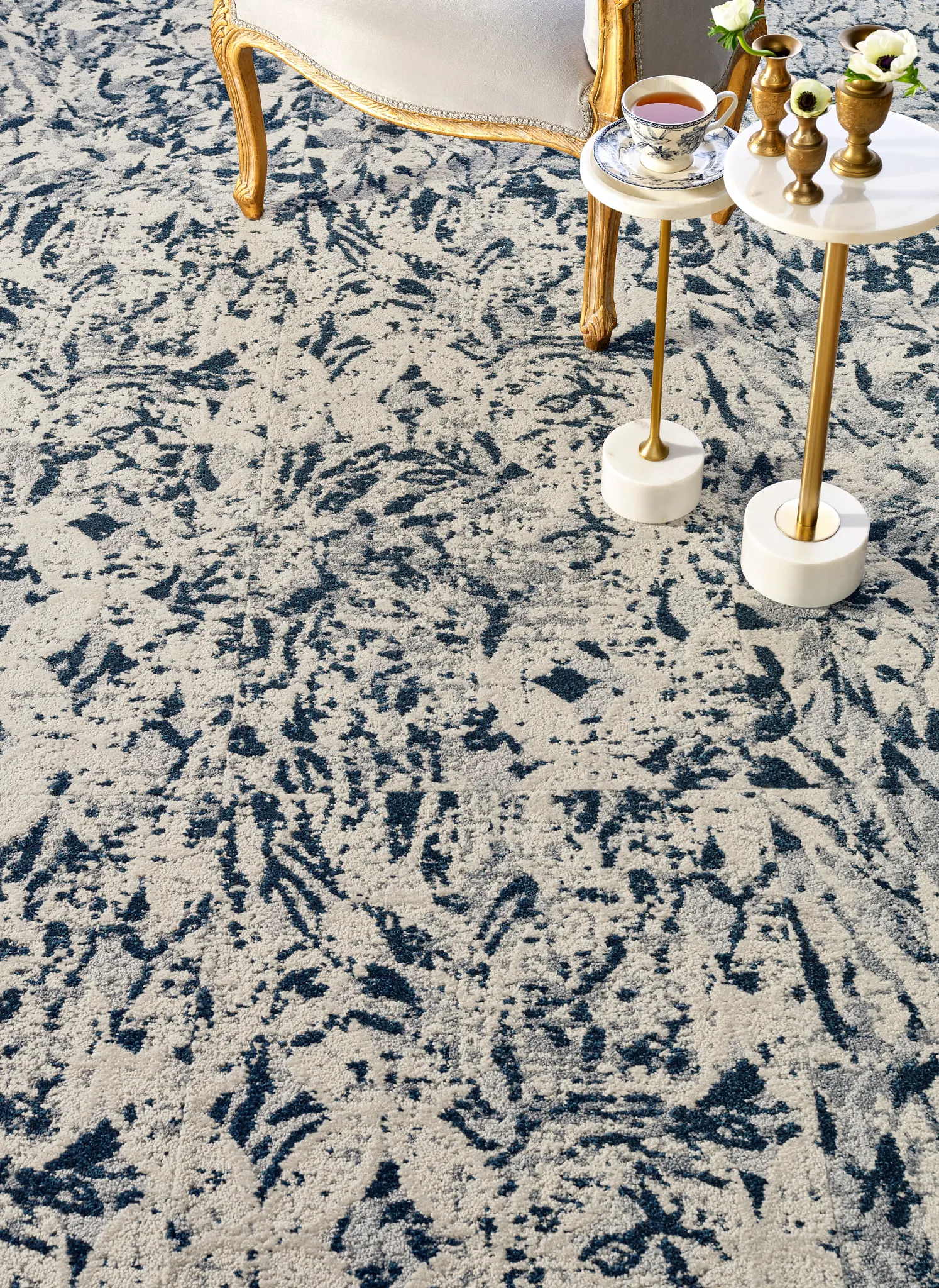 Elegant blue and white patterned carpet in a classic living room setting
