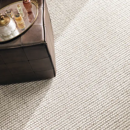 Beige Textured Synthetic Carpet with Leather Ottoman Beige synthetic carpet with textured pattern and leather ottoman