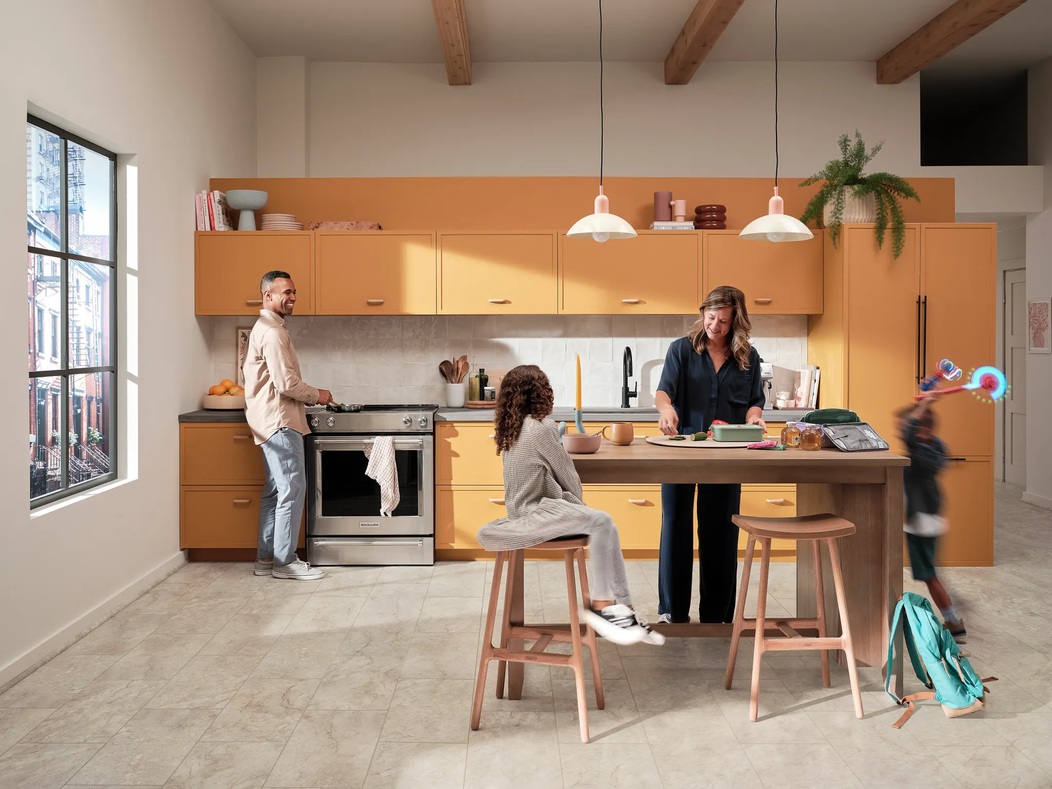 kitchen with luxury vinyl tile floor in a light stone look with a family gathering around a kitchen island
