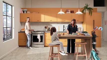 Coretec Residential WPC Luxury Vinyl Tile Flooring in Modern Kitchen - Light Stone Look kitchen with luxury vinyl tile floor in a light stone look with a family gathering around a kitchen island