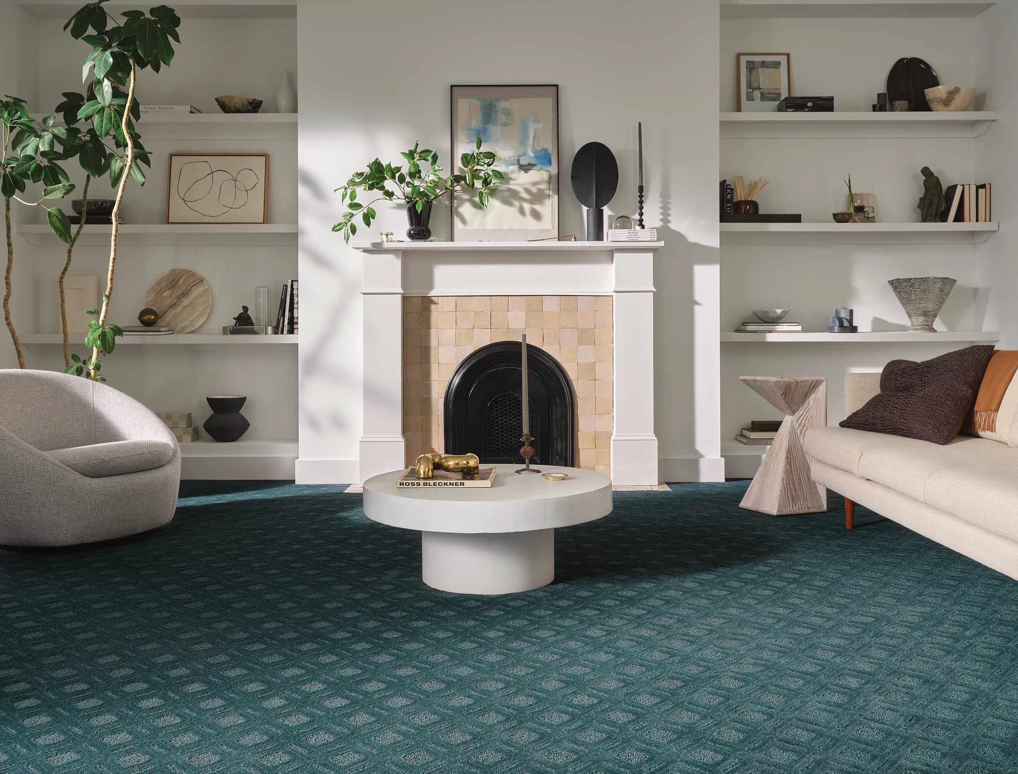 Elegant living room with teal broadloom carpet flooring in a geometric pattern