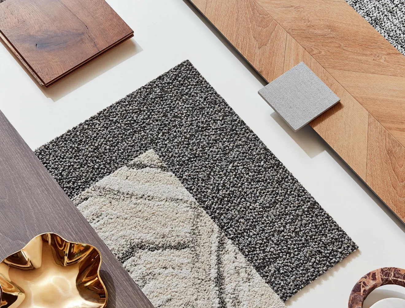 Assorted flooring samples including wood and carpet swatches