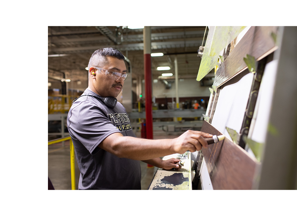 Man inspecting plank products