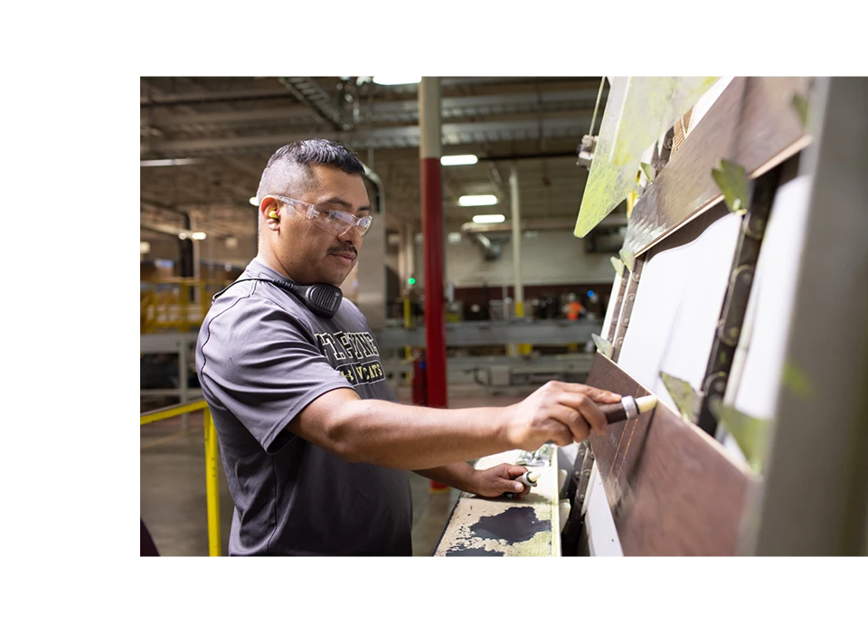 Man inspecting plank products