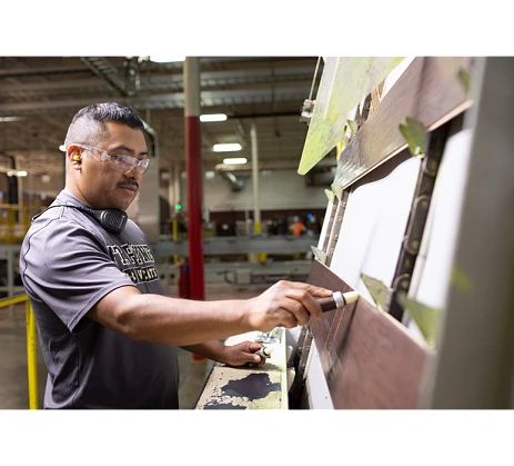 Man inspecting plank products