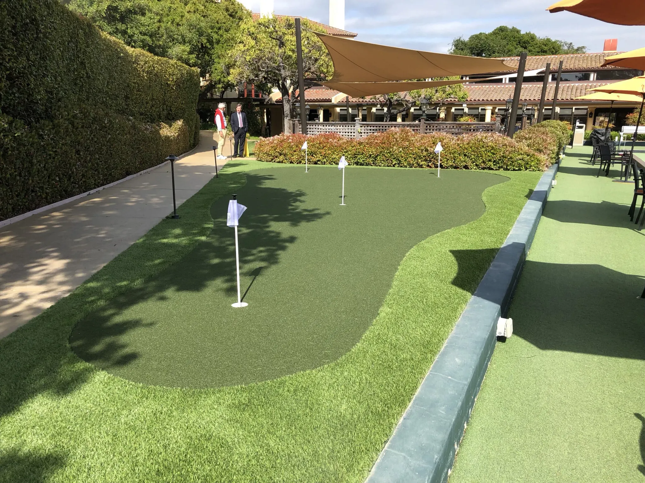 Outdoor putting green with artificial turf