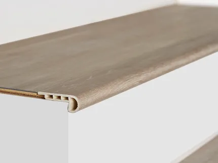 Light Wood Finish Stair Nose for Flooring Transition Light wood finish stair nose with grooved edge